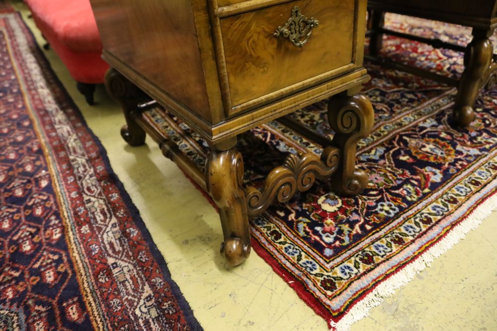 A Queen Anne style walnut kneehole desk, width 128cm, depth 70cm, height 76cm